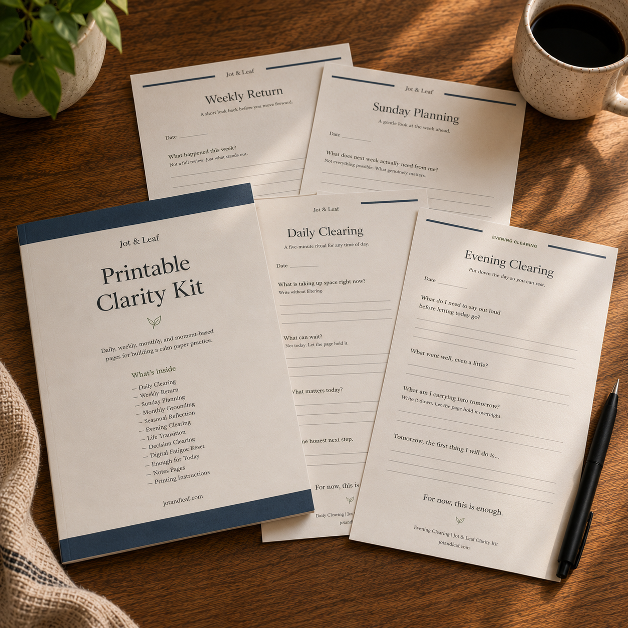 Printable Clarity Kit pages arranged with a pen and coffee
