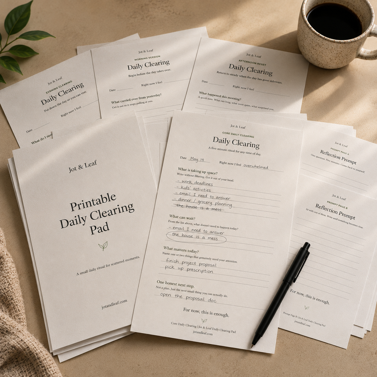 Daily Clearing Pad pages stacked on a desk with a pen and coffee